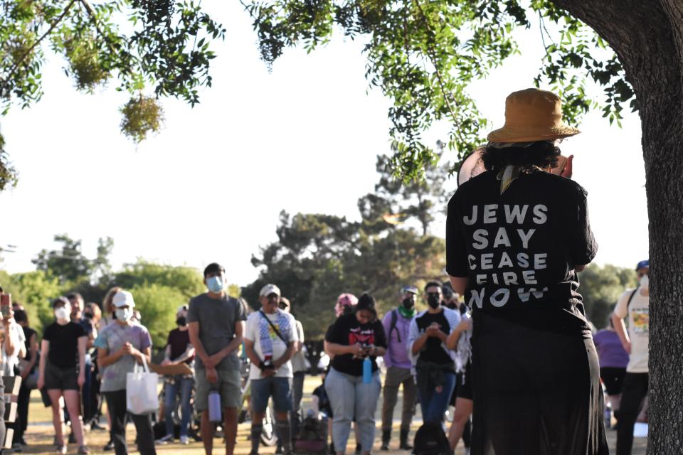 Pro-Palestinian protesters hold a rally at Catalina Park before marching several blocks to the University of Arizona on May 9, 2024.