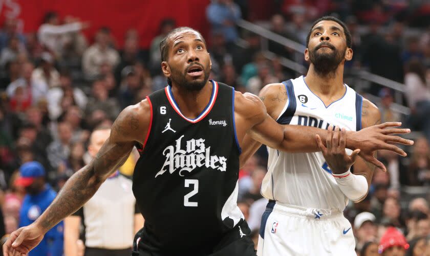 LOS ANGELES, CA - FEBRUARY 08: Clippers Kawhi Leonard and Mavericks Kyrie Irving during the Clippers and Dallas Mavericks game at Crypto.com Arena on Wednesday, Feb. 8, 2023. (Myung J. Chun / Los Angeles Times)