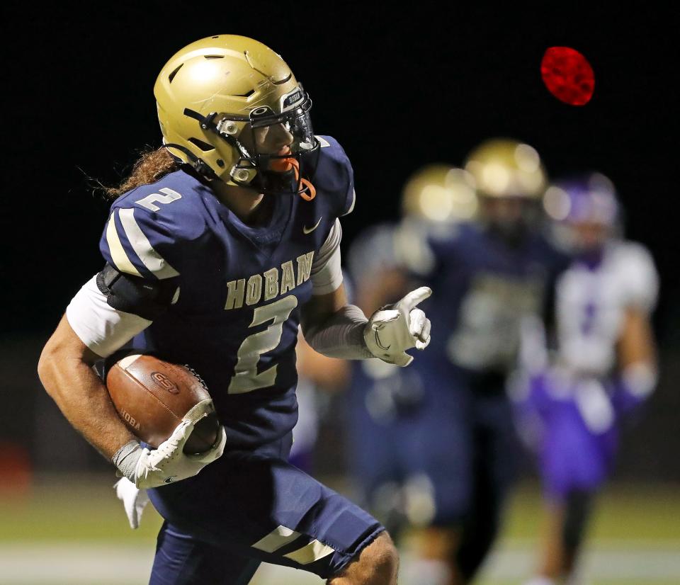 Hoban wide receiver Jayvian Crable scores a receiving touchdown against Barberton during the second half of a Division II playoff football game, Friday, Nov. 4, 2022, in Akron, Ohio.