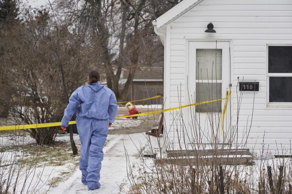 Forensic investigators work at the scene of an ongoing investigation regarding five deaths in southern Manitoba, in Carman, Manitoba, Monday, Feb. 12, 2024. A Canadian man has been charged with five counts of first-degree murder in the deaths of his wife, three young children and a 17-year-old female relative, authorities said Monday. (David Lipnowski/The Canadian Press via AP)