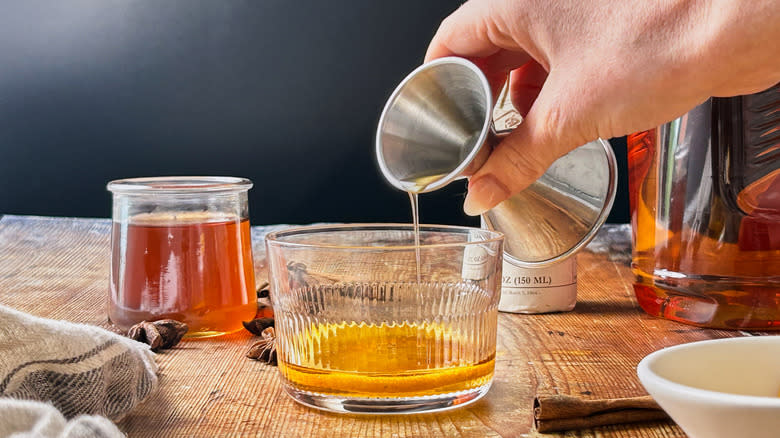 pouring syrup into glass