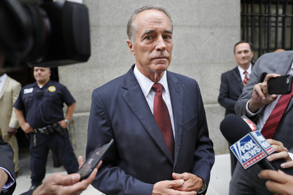 FILE - In this Thursday, Sept. 12, 2019, file photo, U.S. Rep. Chris Collins, R-N.Y., speaks to reporters as he leaves the courthouse after a pretrial hearing in his insider-trading case, in New York. On Tuesday, Dec. 22, 2020, President Donald Trump pardoned 15 people, including Collins. Collins, the first member of Congress to endorse Trump to be president, was sentenced to two years and two months in federal prison after admitting he helped his son and others dodge $800,000 in stock market losses when he learned that a drug trial by a small pharmaceutical company had failed. (AP Photo/Seth Wenig, File)