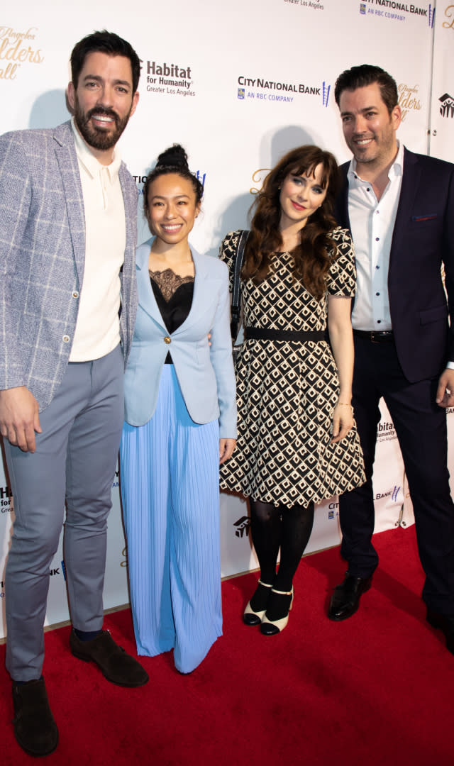 BEVERLY HILLS, CALIFORNIA – MARCH 08: (L-R) Drew Scott, Linda Phan, Zooey Deschanel, and Jonathan Scott walk the red carpet for Habitat LA’s 2023 Los Angeles Builders Ball at The Beverly Hilton on March 08, 2023 in Beverly Hills, California. <em>Photo by Ella Hovsepian/Getty Images.</em>