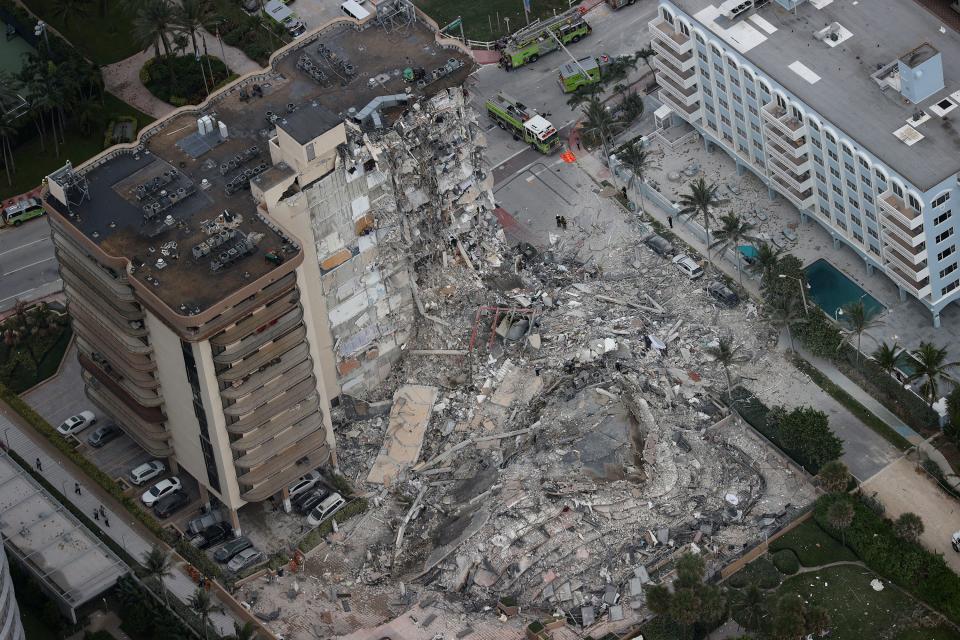 Search and rescue personnel work in the rubble of the 12-story condo tower that crumbled to the ground after a partial collapse of the building on June 24, 2021 in Surfside, Florida. (Getty Images)