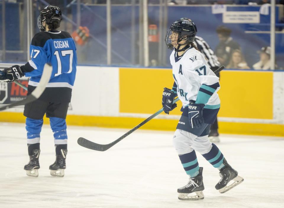 New York defender Ella Shelton smiles as she skates to the bench after scoring the first goal in PWHL history against Toronto during first period action in Toronto on Monday Jan. 1, 2024. (Frank Gunn/The Canadian Press via AP)