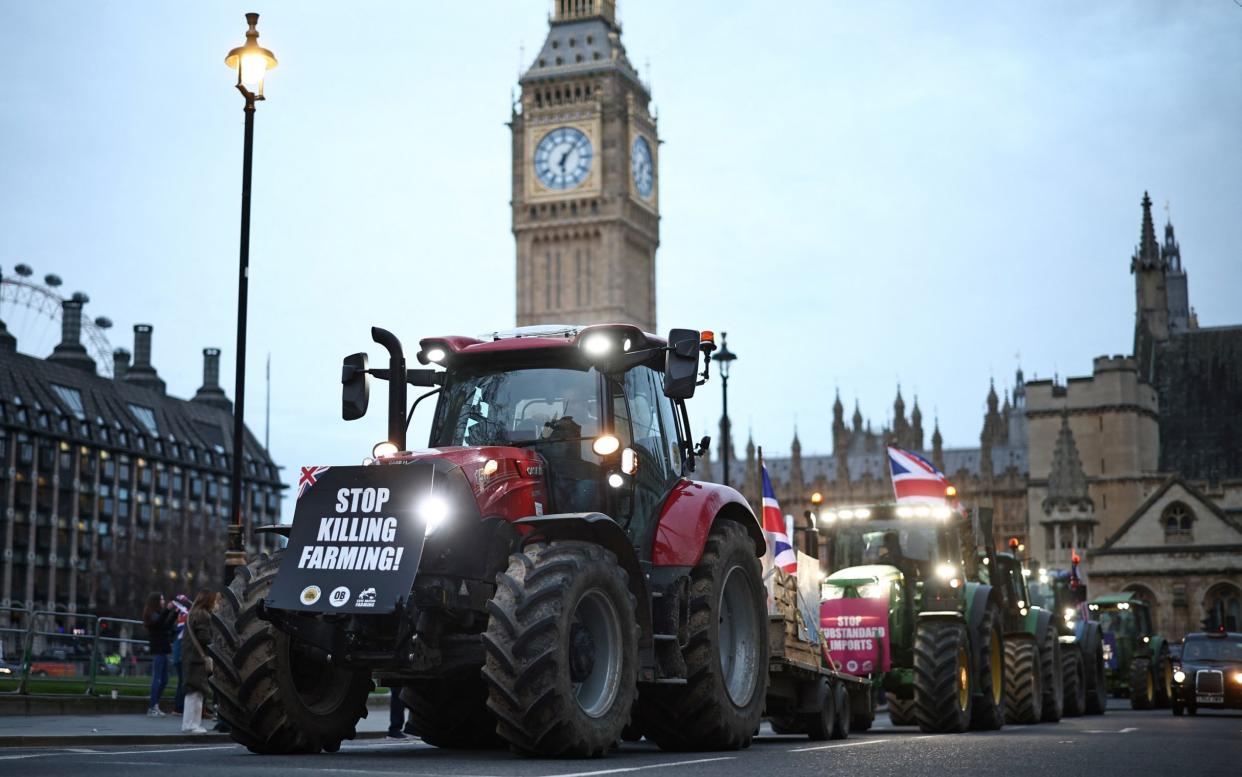 Farmers drive tractors around Parliament Square during a demonstration organised by Save British Farming