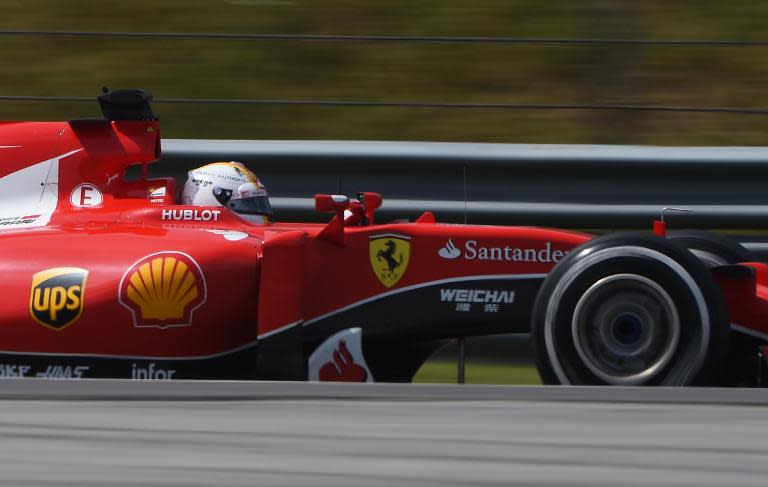 Sebastian Vettel takes a corner during the Formula One Malaysian Grand Prix in Sepang on March 29, 2015