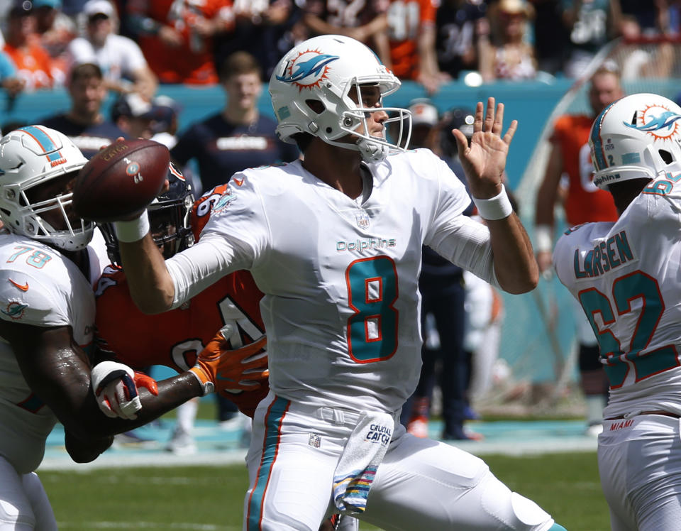 Miami Dolphins quarterback Brock Osweiler (8) looks to pass, during the first half of an NFL football game against the Chicago Bears, Sunday, Oct. 14, 2018, in Miami Gardens, Fla. (AP Photo/Joel Auerbach)