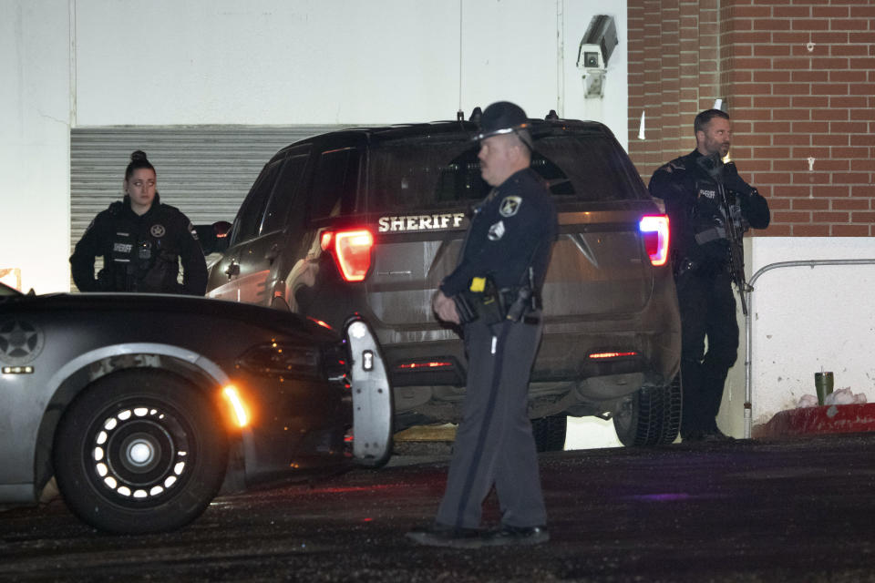 Law enforcement personnel stand guard next to a garage entrance at the Latah County Courthouse after Bryan Kohberger, who is accused of killing four University of Idaho students in November 2022, arrived in a police motorcade at the courthouse, Wednesday, Jan. 4, 2023, in Moscow, Idaho, following his extradition from Pennsylvania. (AP Photo/Ted S. Warren)