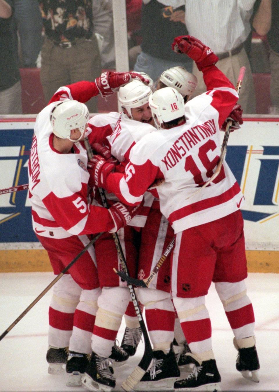Teammates pile on Darren McCarty after his breakaway goal in the second period of Game 4 of the Stanley Cup Finals at Joe Louis Arena, June 7, 1997. At right is Vladimir Konstantinov and Nicklas Lidstrom on at left.
