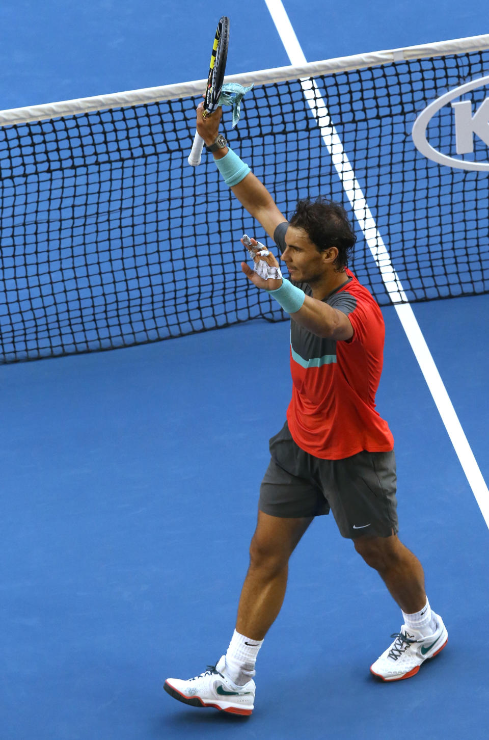 Rafael Nadal of Spain celebrates after his win over Kei Nishikori of Japan during their fourth round match at the Australian Open tennis championship in Melbourne, Australia, Monday, Jan. 20, 2014.(AP Photo/Eugene Hoshiko)