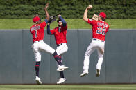 Minnesota Twins left fielder Nick Gordon (1) is joined by center fielder Gilberto Celestino, center, and right fielder Max Kepler (26) after defeating the Colorado Rockies in a baseball game Sunday, June 26, 2022, in Minneapolis. (AP Photo/Andy Clayton-King)