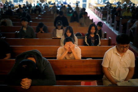 Students pray during an early-morning prayer session at the Presbyterian University and Theological Seminary (PUTS) in Seoul, South Korea, September 12, 2017. Picture taken on September 12, 2017. REUTERS/Kim Hong-Ji