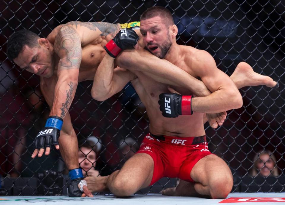 Mateusz Gamrot of Poland fights against Rafael Dos Anjos of Brazil during their lightweight title match during the UFC 299 event at the Kaseya Center on Saturday, March 9, 2024, in downtown Miami, Fla.