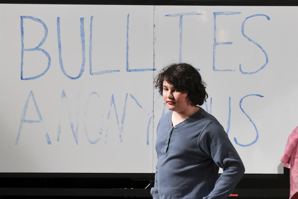 Oliver Baez performs in a scene from “The Bullying Collection” at Wheatland High School in Wheatland, Wyoming on Friday, Jan. 12, 2024. School officials canceled the middle school play in part because it mentioned a gay character. The anti-bullying play was nonetheless performed under private sponsorship. (AP Photo/Thomas Peipert)