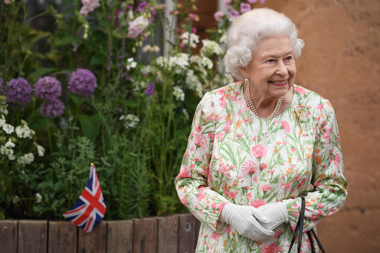 ST AUSTELL, ENGLAND - JUNE 11: Queen Elizabeth II smiles as she meets people from communities across Cornwall during an event in celebration of The Big Lunch initiative at The Eden Project during the G7 Summit on June 11, 2021 in St Austell, Cornwall, England. UK Prime Minister, Boris Johnson, hosts leaders from the USA, Japan, Germany, France, Italy and Canada at the G7 Summit. This year the UK has invited India, South Africa, and South Korea to attend the Leaders' Summit as guest countries as well as the EU. (Photo by Oli Scarff - WPA Pool / Getty Images)