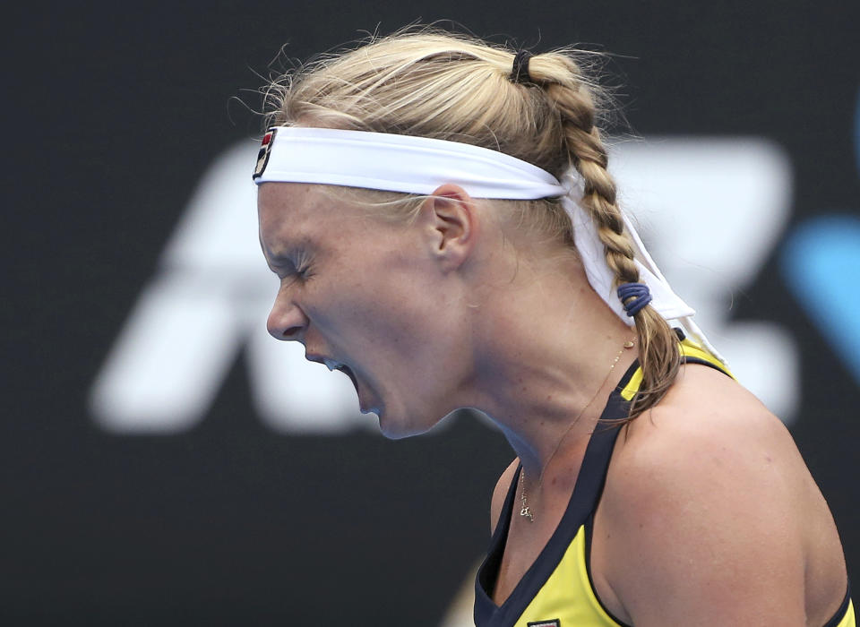 Kiki Bertens of the Netherlands yells out while playing Ash Barty of Australia during their women's singles semifinal match at the Sydney International tennis tournament in Sydney, Friday, Jan. 11, 2019. (AP Photo/Rick Rycroft)