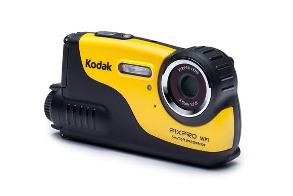 Yellow Kodak PixPro camera, a small handheld camera standing on a flat surface.