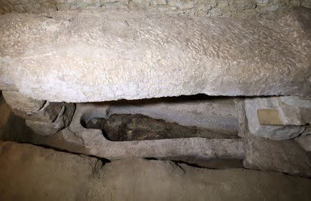 A mummy is seen inside the newly discovered burial site near Egypt's Saqqara necropolis, in Giza Egypt July 14, 2018. REUTERS/Mohamed Abd El Ghany
