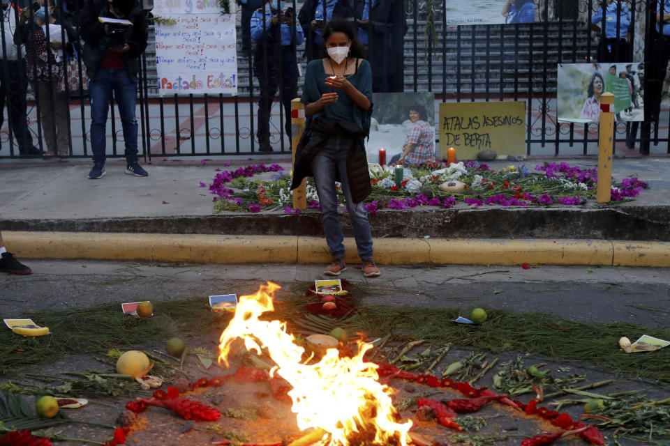 Berta Zuniga, a daughter of environmental and Indigenous rights activist Berta Caceres, takes part in a spiritual ceremony, a day before a trial against one of the alleged masterminds of the killing of Caceres, in Tegucigalpa, Honduras, Monday, April 5, 2021. The trial of Roberto David Castillo is expected to run through April. The government has already convicted seven people in Caceres' murder, but is Castillo is considered a potentially critical link to those who ordered it. (AP Photo/Elmer Martinez)