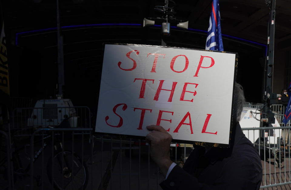 A Trump supporter holds a sign outside the Pennsylvania Convention Center in Philadelphia after Joe Biden was projected the winner of the 2020 presidential election on Nov. 7. (Photo: BRYAN R. SMITH via Getty Images)