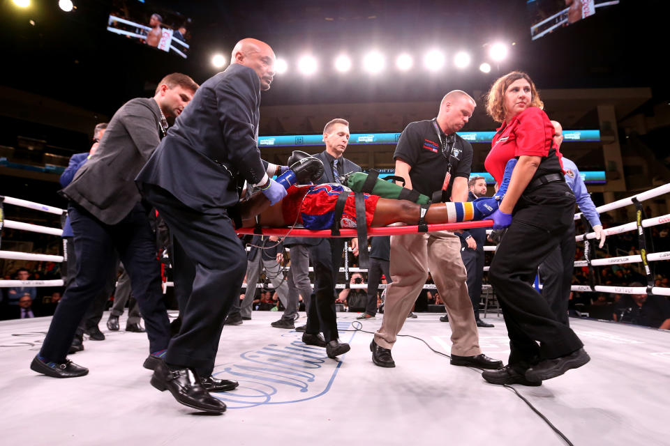 Patrick Day is taken out of the ring after being knocked out during his Super-Welterweight bout against Charles Conwell in Chicago, Illinois. (Getty Images)