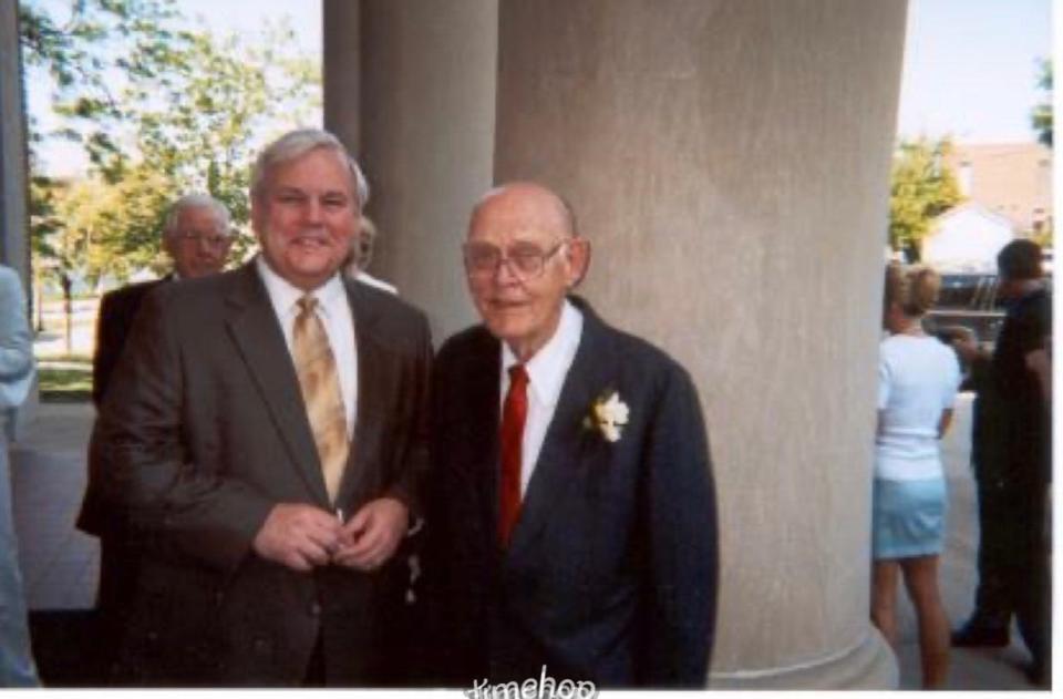 Pete Weber, left, poses for a photo with his father, John, at a wedding in 2003. Weber just finished his 25th regular season as a broadcaster with the Nashville Predators and is calling his 16th postseason for the team.