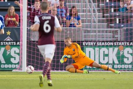 Oct 10, 2015; Commerce City, CO, USA; Colorado Rapids midfielder Sam Cronin (6) watches as Montreal Impact goalkeeper Evan Bush (1) makes a save in the second half at Dick's Sporting Goods Park. The Impact defeated the Rapids 1-0. Mandatory Credit: Isaiah J. Downing-USA TODAY Sports