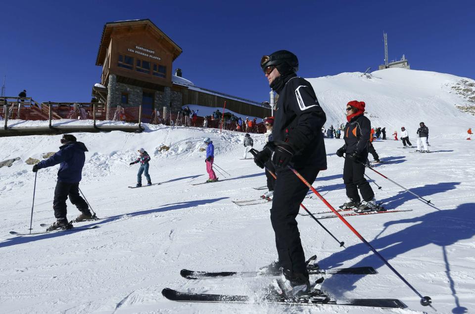 People ski on the top of Saulire mountain in Meribel