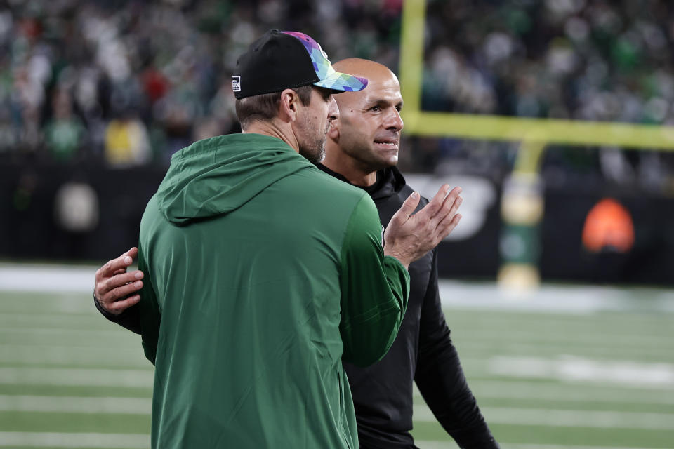 New York Jets quarterback Aaron Rodgers, left, celebrates with head coach Robert Saleh after an NFL football game against the Philadelphia Eagles, Sunday, Oct. 15, 2023, in East Rutherford, N.J. (AP Photo/Adam Hunger)