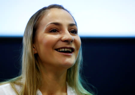 Germany's Olympic and world sprint cycling champion Kristina Vogel addresses a news conference for the first time since being paralysed following a serious crash in training, at the Unfallkrankenhaus hospital in Berlin, Germany, September 12, 2018. REUTERS/Fabrizio Bensch