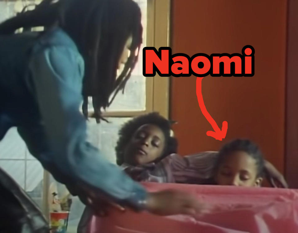 Naomi Campbell is tucked in by Bob Marley along with another child in his music video for "Is This Love"