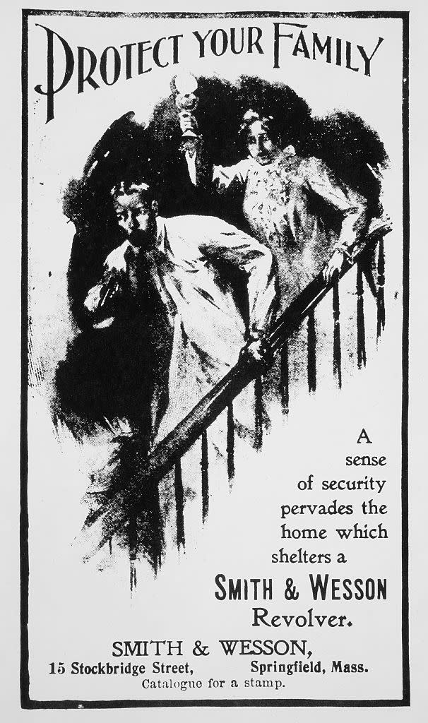 Frightened husband with gun and wife on stairway, "Protect Your Family", advertisement, Smith & Wesson, circa 1901.<span class="copyright">Universal History Archive/Universal Images Group—Getty Images</span>