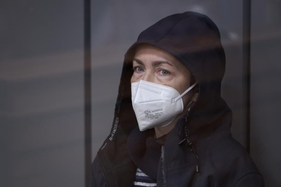 FILE -Radio Free Europe-Radio Liberty editor Alsu Kurmasheva sits in a glass cage in a courtroom in Kazan, Russia, on Oct. 23, 2023. A Russian court has ordered a detained Russian-American journalist to be held in jail for two more months pending her trial on charges of failing to register as a foreign agent. Alsu Kurmasheva, an editor for the U.S. government-funded Radio Free Europe/Radio Liberty’s Tatar-Bashkir service, was taken into custody on Oct. 18 on charges of not registering as a foreign agent while collecting information about the Russian military. (AP Photo/Vladislav Mikhnevskii, File)