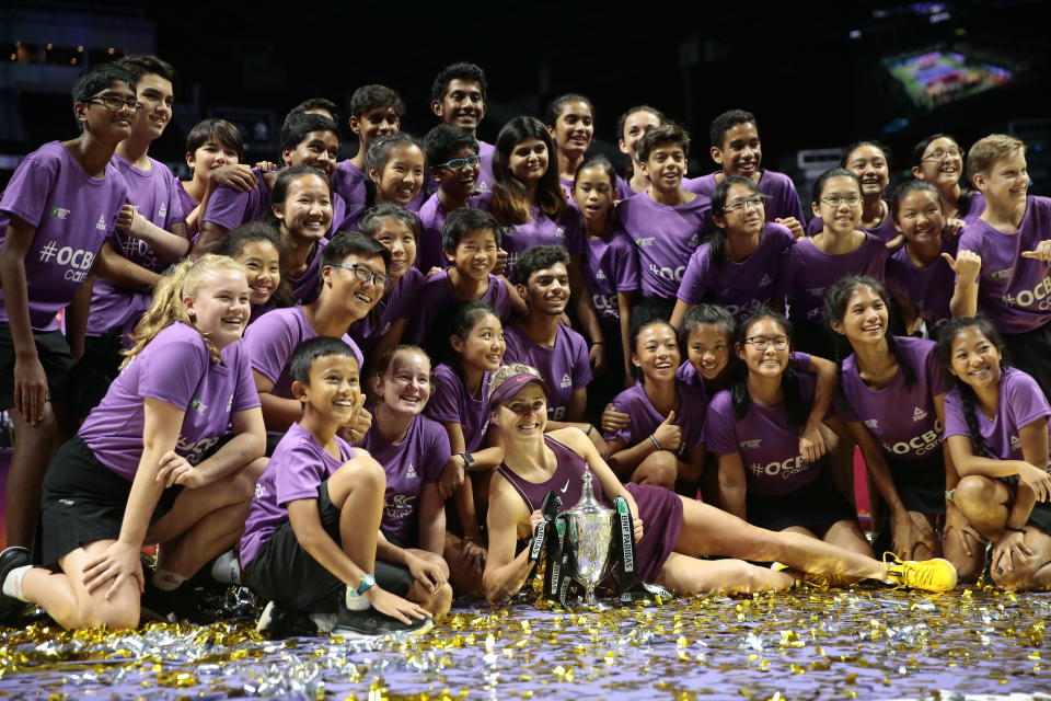 WTA Finals Singapore 2018 singles winner Elina Svitolina poses with the tournament ball kids after beating Sloane Stephens in the final match on 28 October 2018. (PHOTO: EFE/EPA/Wallace Woon)