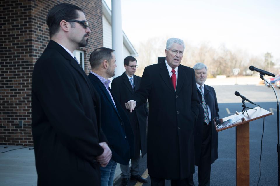  Attorney Thomas S. Neuberger, center, speaks during a press conference Wednesday, Dec. 1, 2021, at Townsend Free Will Baptist Church. Two pastors have filed separate lawsuits asking Delaware courts to prevent the state from imposing future restrictions on religious worship.