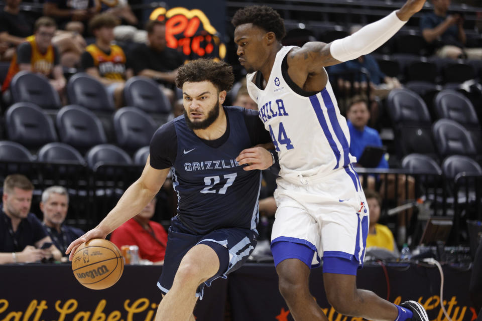 Memphis Grizzlies forward David Roddy (27) drives against Philadelphia 76ers forward Paul Reed Jr. (44) during the first half of an NBA summer league basketball game Tuesday, July 5, 2022, in Salt Lake City. (AP Photo/Jeff Swinger)