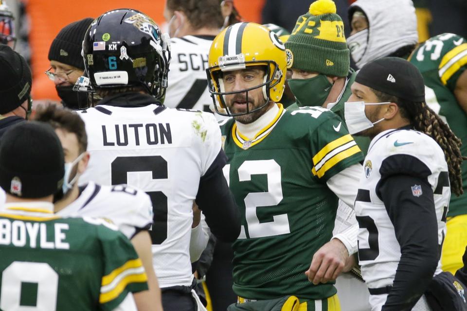 Green Bay Packers' Aaron Rodgers talks to Jacksonville Jaguars' Jake Luton after an NFL football game Sunday, Nov. 15, 2020, in Green Bay, Wis. The Packers won 24-20. (AP Photo/Mike Roemer)