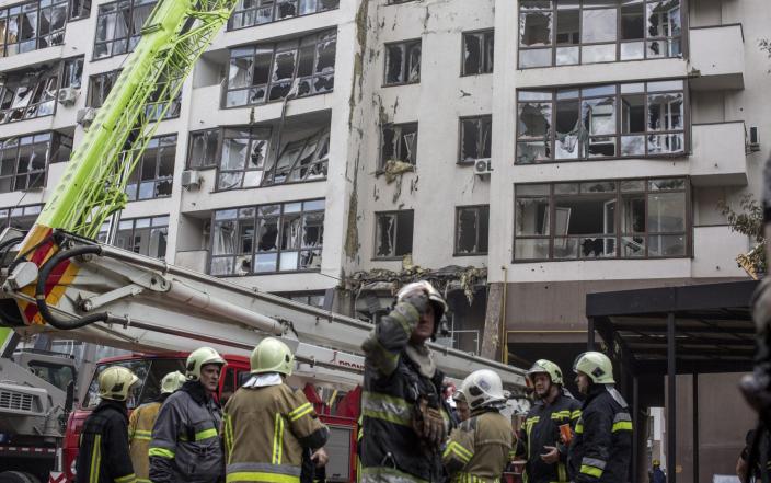 KYIV, KYIV PROVINCE, UKRAINE, JUNE 26: Firemen work at the scene of a residential building following explosions in a neighborhood in north of Kyiv, Ukraine, June 26th, 2022. Several explosions targeted the Ukrainian capital in the early hours on this Sunday morning, with at least two residential buildings and one kindergarten struck, accordingly with official sources. (Photo by Narciso Contreras/Anadolu Agency via Getty Images)&nbsp; - Narciso Contreras/Anadolu Agency via Getty Images