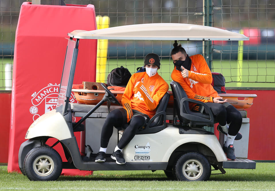 <p>MANCHESTER, ENGLAND - MARCH 12: (EXCLUSIVE COVERAGE) Bruno Fernandes and Alex Telles of Manchester United in action during a first team training session at Aon Training Complex on March 12, 2021 in Manchester, England. (Photo by Matthew Peters/Manchester United via Getty Images)</p>
