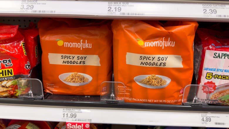 packages of momofuku noodles on shelf at grocery store