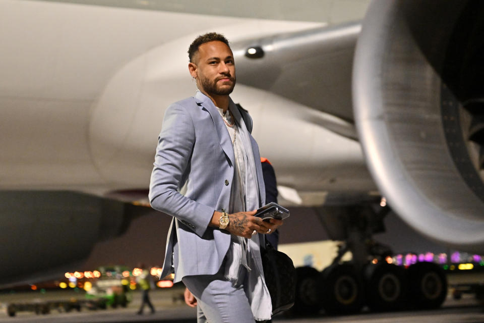 DOHA, QATAR - NOVEMBER 19: Neymar of Team Brazil  disembarks from a Qatar Airways flight upon arrival ahead of the FIFA World Cup Qatar 2022 at Hamad International Airport Special Events Terminal on November 19, 2022 in Doha, Qatar. (Photo by Tullio Puglia - FIFA/FIFA via Getty Images)