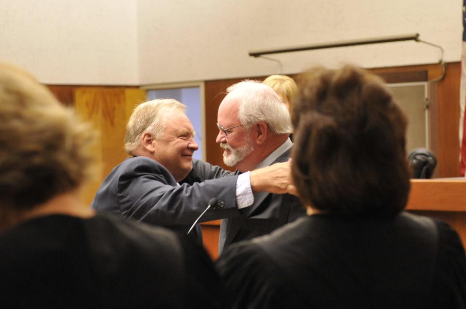 Bruce McDermott, left, accepts the award from former District Attorney Phil Cline on May 3, 2010 during Law Day in Visalia, Calif.