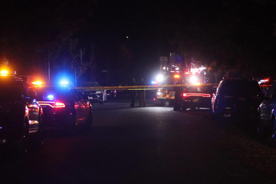 Police and emergency personnel work at the scene of a shooting at a backyard party, Sunday, Nov. 17, 2019, in southeast Fresno, Calif. (Photo: Larry Valenzuela/The Fresno Bee via AP)