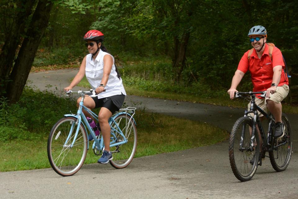 Alejandra Constante and James Elwood of Windsor ride their bicycles on the Quinebaug River Trail in Killingly in this file photo. Plainfield is planning to add its own section to the roughly 5-mile, disjointed trail, which also has a length in Putnam.