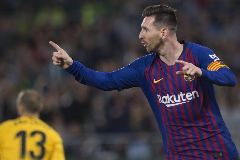 Barcelona's Argentinian forward Lionel Messi celebrates after scoring his second goal during the Spanish league football match between Real Betis and FC Barcelona at the Benito Villamarin stadium in Seville on March 17, 2019. (Photo by JORGE GUERRERO / AFP)        (Photo credit should read JORGE GUERRERO/AFP/Getty Images)