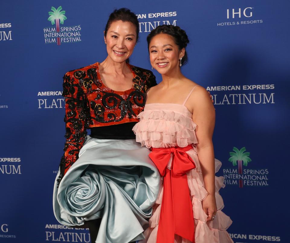 Michelle Yeoh and Stephanie Hsu take a photo backstage at the Palm Springs International Film Festival awards gala in Palm Springs, Calif., Jan. 5, 2023.