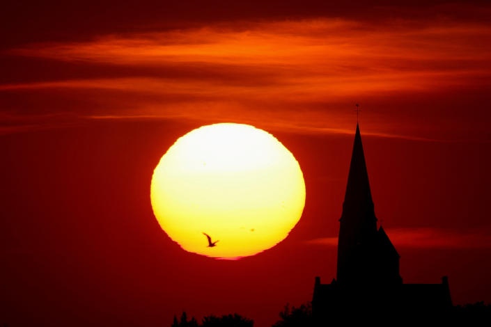 A church is pictured during sunset as a heat wave hits Europe, in Oisy-le-Verger, France, on July 14.