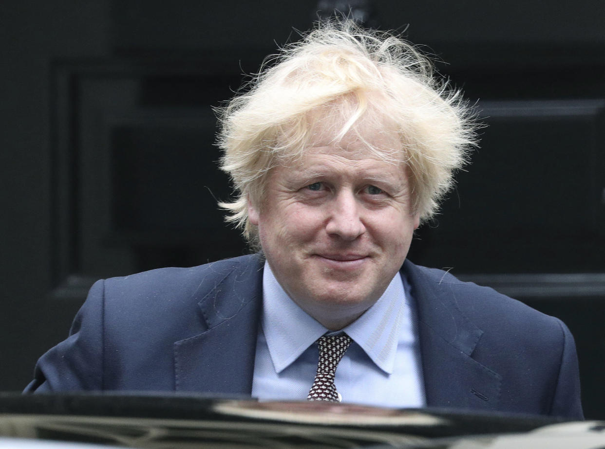 Britain's Prime Minister Boris Johnson leaves 10 Downing Street for PMQs in the House of Commons, London,  Wednesday June 3, 2020. (Jonathan Brady/PA via AP)