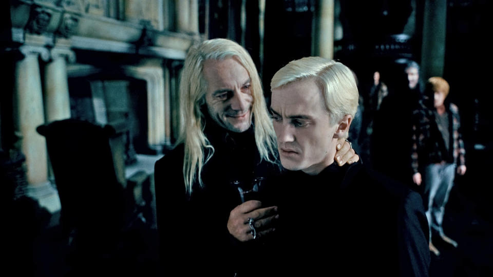 Isaacs and Tom Felton in Harry Potter (Credit: Warner Bros)